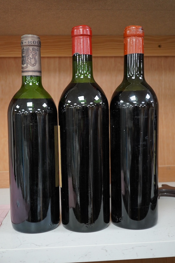 Three bottles including; Chateau Mouton Rothschild 1956, Château Guiraud Pavillon Rouge 1973 and Chateau Figeac St Emilion 1969. Condition - fair.